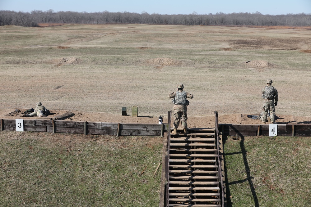 Soldiers get into a comfortable prone position during weapons qualification