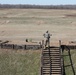 Soldiers get into a comfortable prone position during weapons qualification