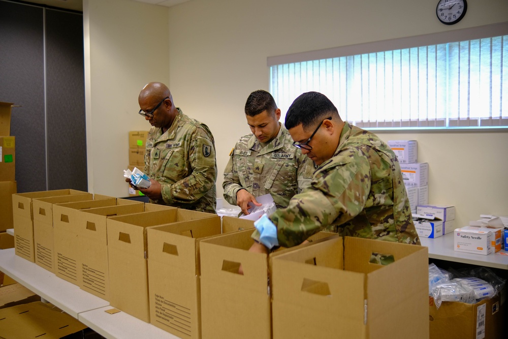 Soldiers prepare COVID-19 boxes for distribution