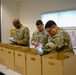 Soldiers prepare COVID-19 boxes for distribution