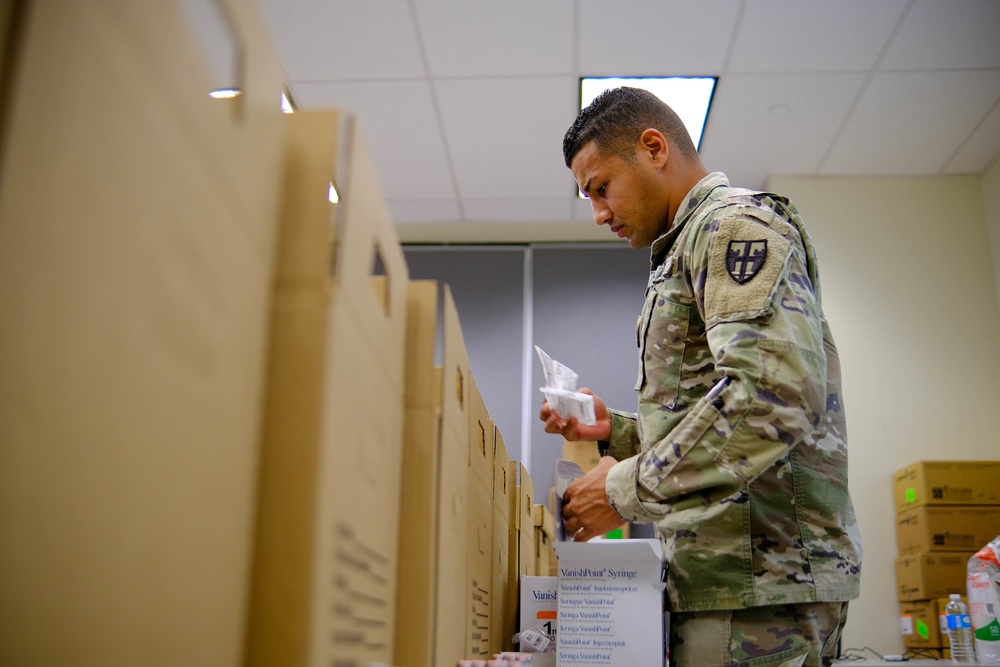 Soldiers prepare COVID-19 boxes for distribution