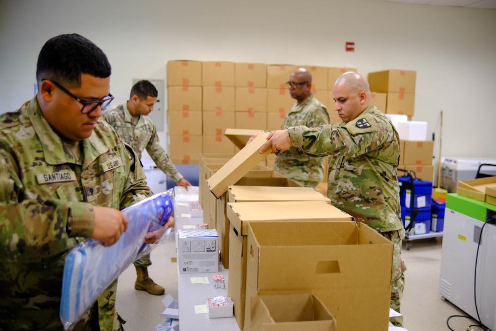 Soldiers prepare COVID-19 boxes for distribution