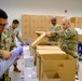 Soldiers prepare COVID-19 boxes for distribution
