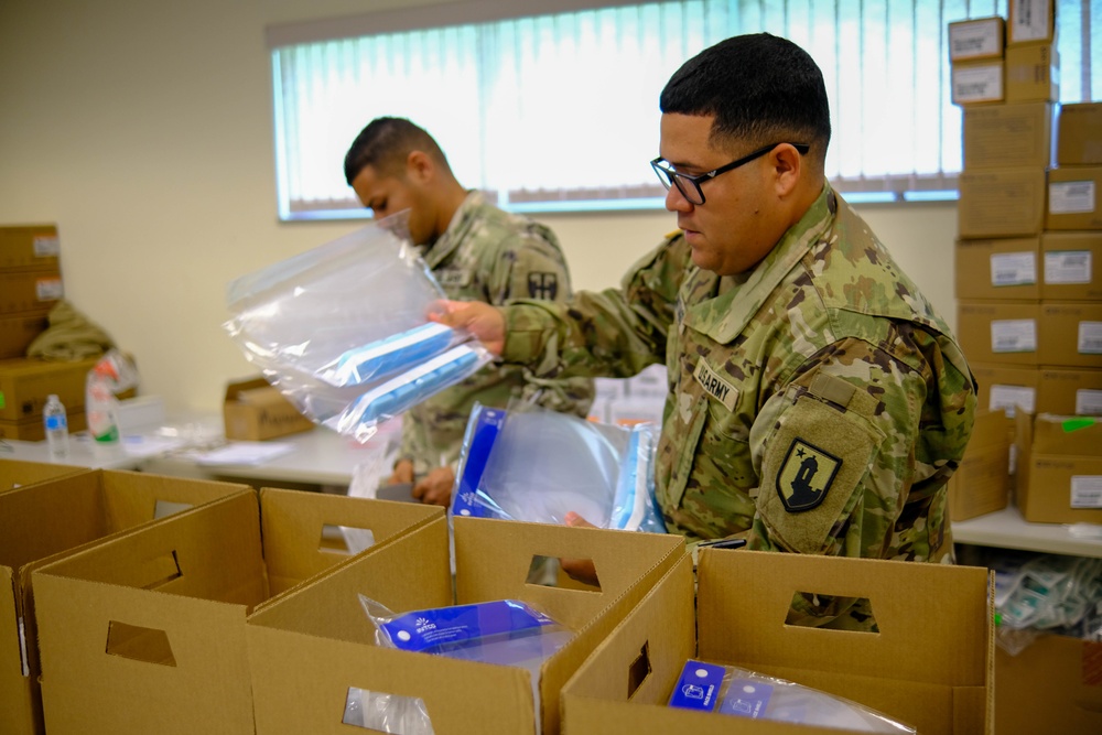 Soldiers prepare COVID-19 boxes for distribution