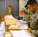 Soldiers prepare COVID-19 boxes for distribution