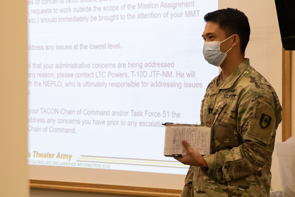 Military medical team receives a JRSOI brief at local Shiprock hospital