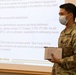 Military medical team receives a JRSOI brief at local Shiprock hospital