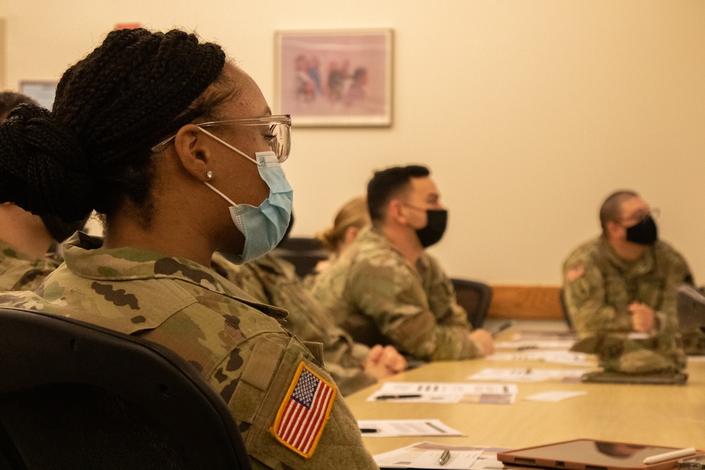 Military medical team receives a JRSOI brief at local Shiprock hospital