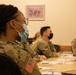 Military medical team receives a JRSOI brief at local Shiprock hospital