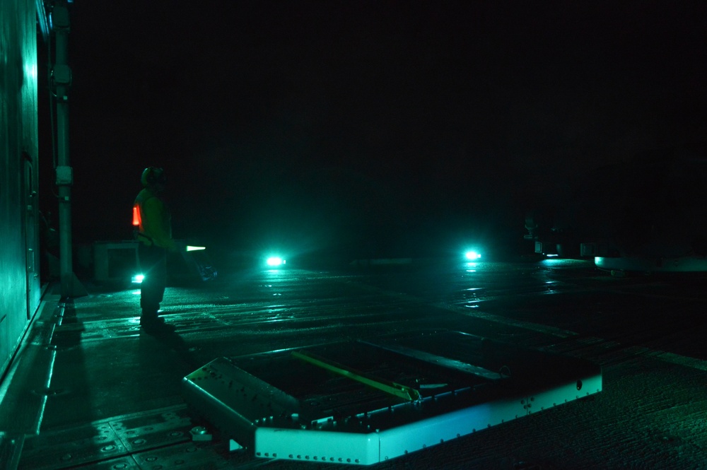 USS Lake Champlain conducts night flight operations in the Philippine Sea