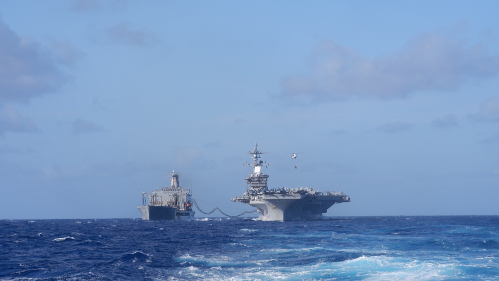 USS Lake Champlain conducts replenishment-at-sea operations in the Philippine Sea