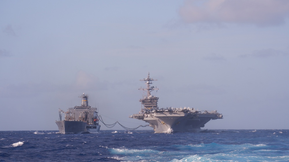 USS Lake Champlain conducts replenishment-at-sea operations in the Philippine Sea