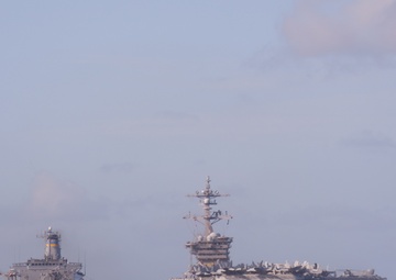 USS Lake Champlain conducts replenishment-at-sea operations in the Philippine Sea