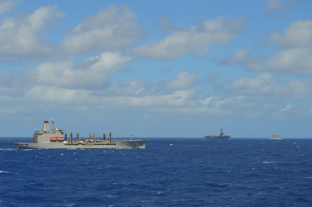 USS Lake Champlain conducts replenishment-at-sea operations in the Philippine Sea