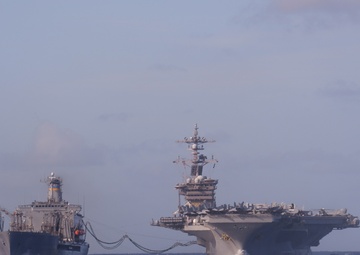 USS Lake Champlain conducts replenishment-at-sea operations in the Philippine Sea