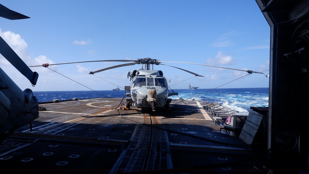 USS Lake Champlain conducts replenishment-at-sea operations in the Philippine Sea