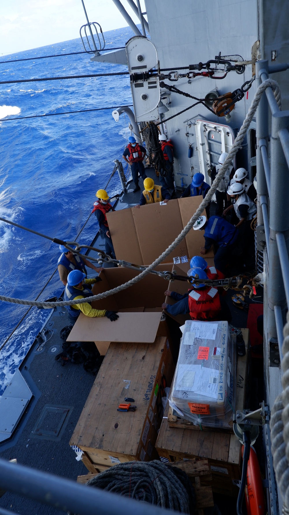 USS Lake Champlain conducts replenishment-at-sea operations in the Philippine Sea