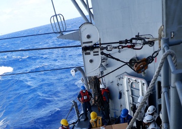 USS Lake Champlain conducts replenishment-at-sea operations in the Philippine Sea