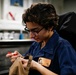 Abraham Lincoln Sailor removes stitching