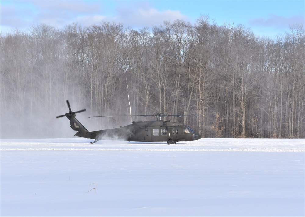 Soldiers receive an airlift home after a cold day