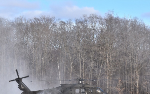 Soldiers receive an airlift home after a cold day