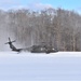 Soldiers receive an airlift home after a cold day