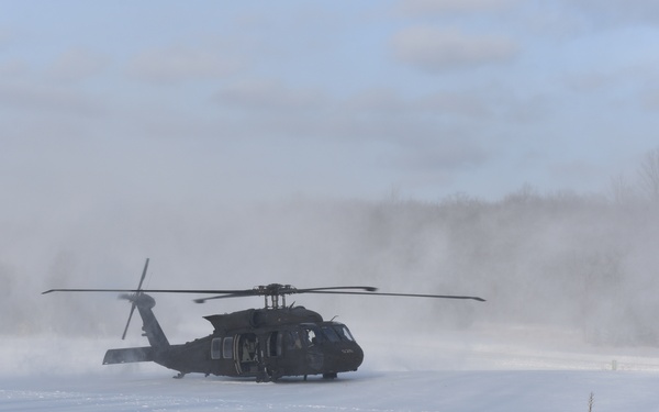 Helicopter blades stir up snow during cold weather training