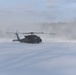 Helicopter blades stir up snow during cold weather training