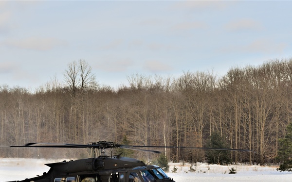Soldiers receive an airlift home after a cold day