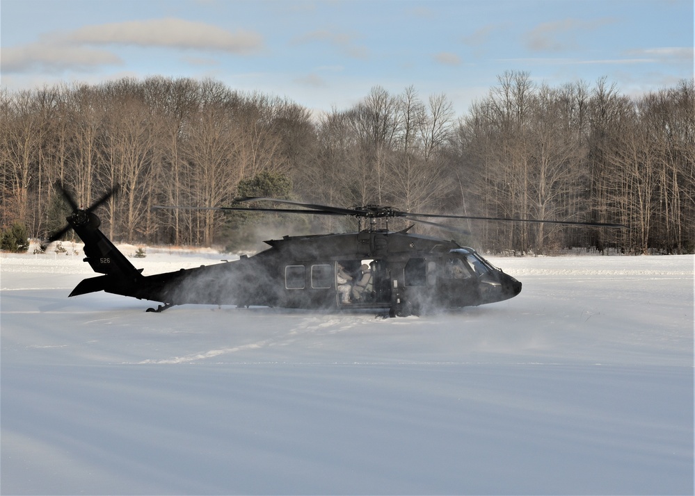 Helicopter blades stir up snow during cold weather training