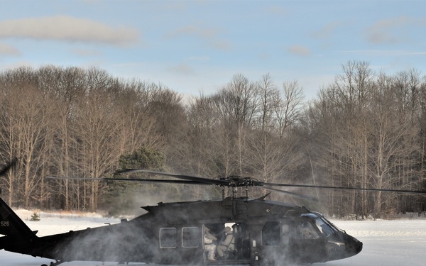 Helicopter blades stir up snow during cold weather training