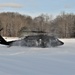 Helicopter blades stir up snow during cold weather training