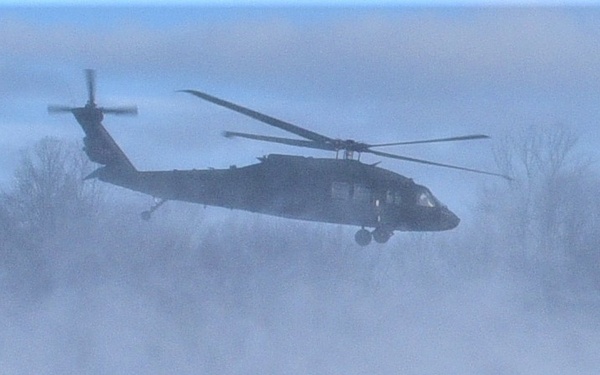 Helicopter blades stir up snow during cold weather training
