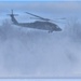 Helicopter blades stir up snow during cold weather training