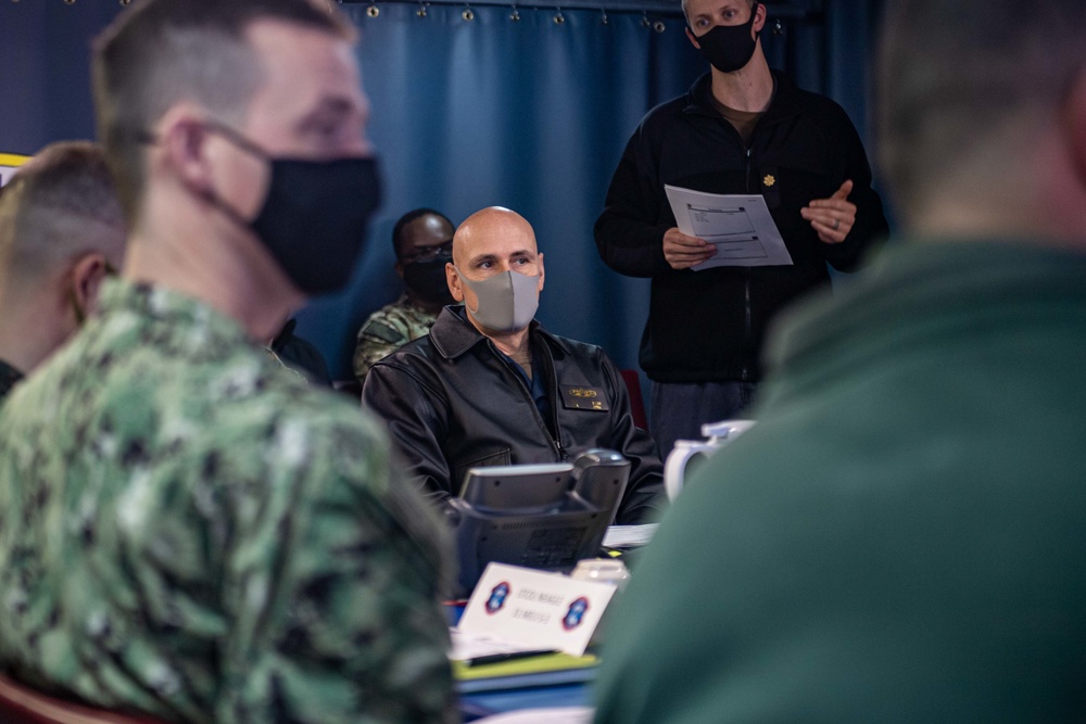 Commodore of Phibron 11 conducts pre-sail conference aboard USS America.