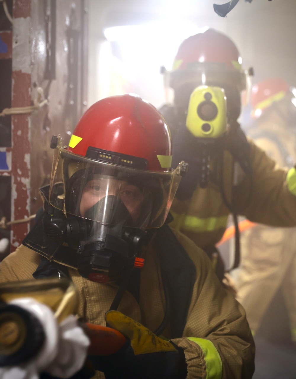 Sailors and Firefighters from USS Barry, USS Howard and CFAY Emergency Services Conduct Integrated Fire Drill