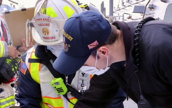 Sailors and Firefighters from USS Barry, USS Howard and CFAY Emergency Services Conduct Integrated Fire Drill