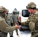 Command Sgt. Maj. Patrouille Presents His Challenge Coin to Wisconsin Soldiers