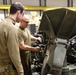Michigan and Wisconsin National Guard Soldiers maintain howitzer at MATES during Winter Strike