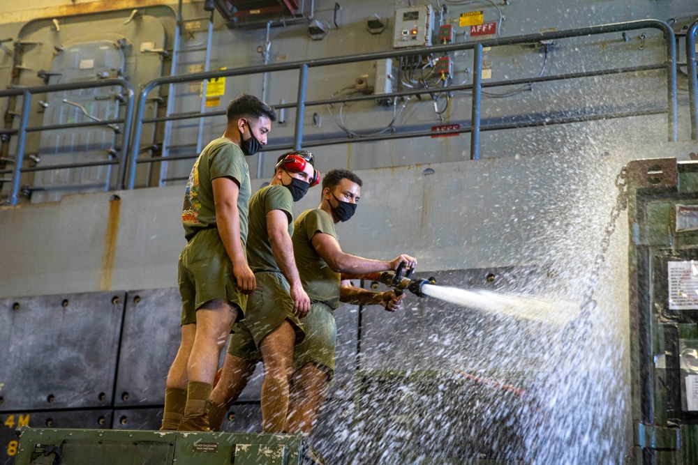 11th MEU, USS Portland wash down vehicles underway