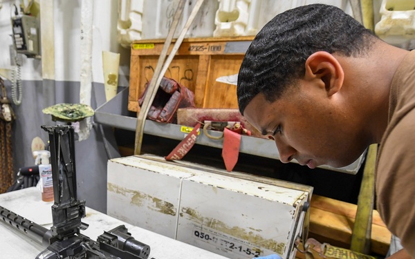 USS Chafee (DDG 90) Sailors Conduct Gun Maintenance