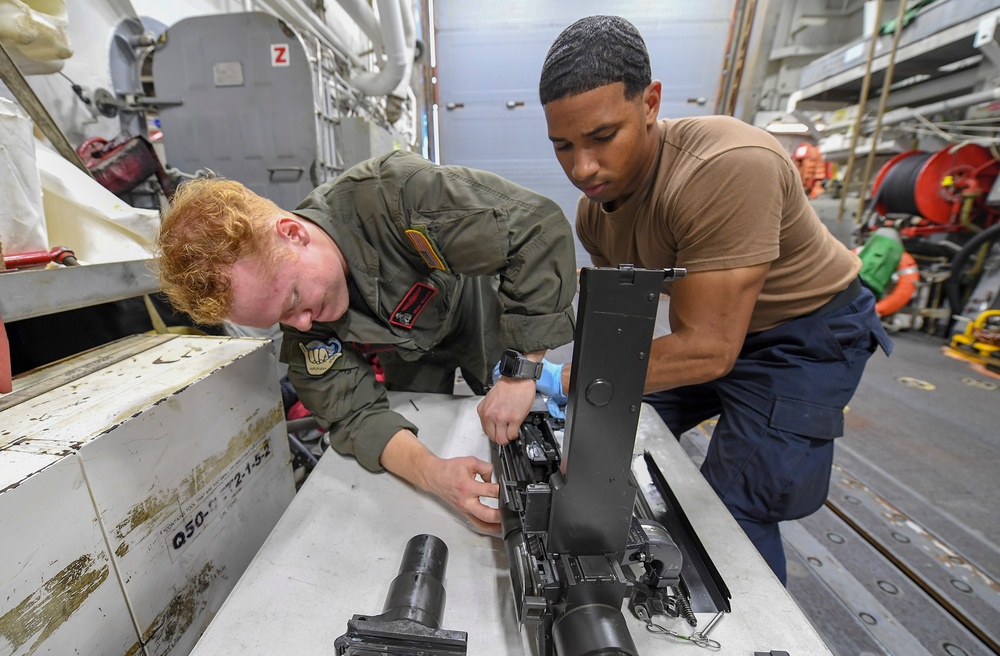 USS Chafee (DDG 90) Sailors Conduct Gun Maintenance