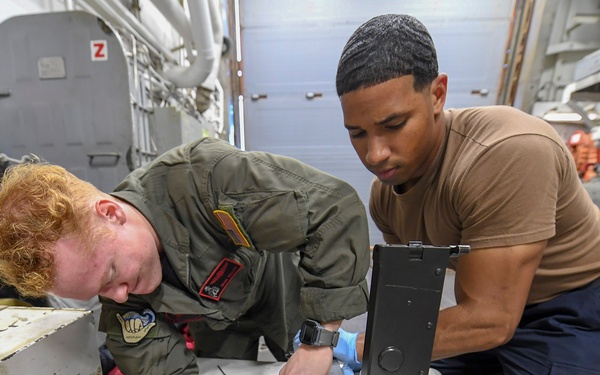USS Chafee (DDG 90) Sailors Conduct Gun Maintenance