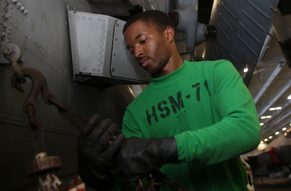 Abraham Lincoln Sailors conduct aircraft maintenance