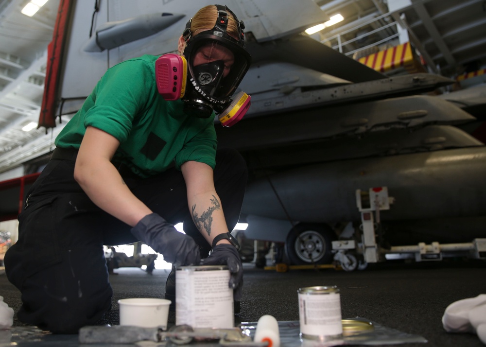 Abraham Lincoln Sailors conduct aircraft maintenance