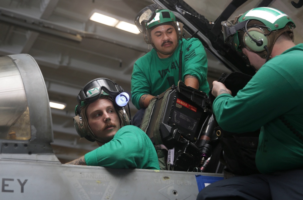 Abraham Lincoln Sailors conduct aircraft maintenance