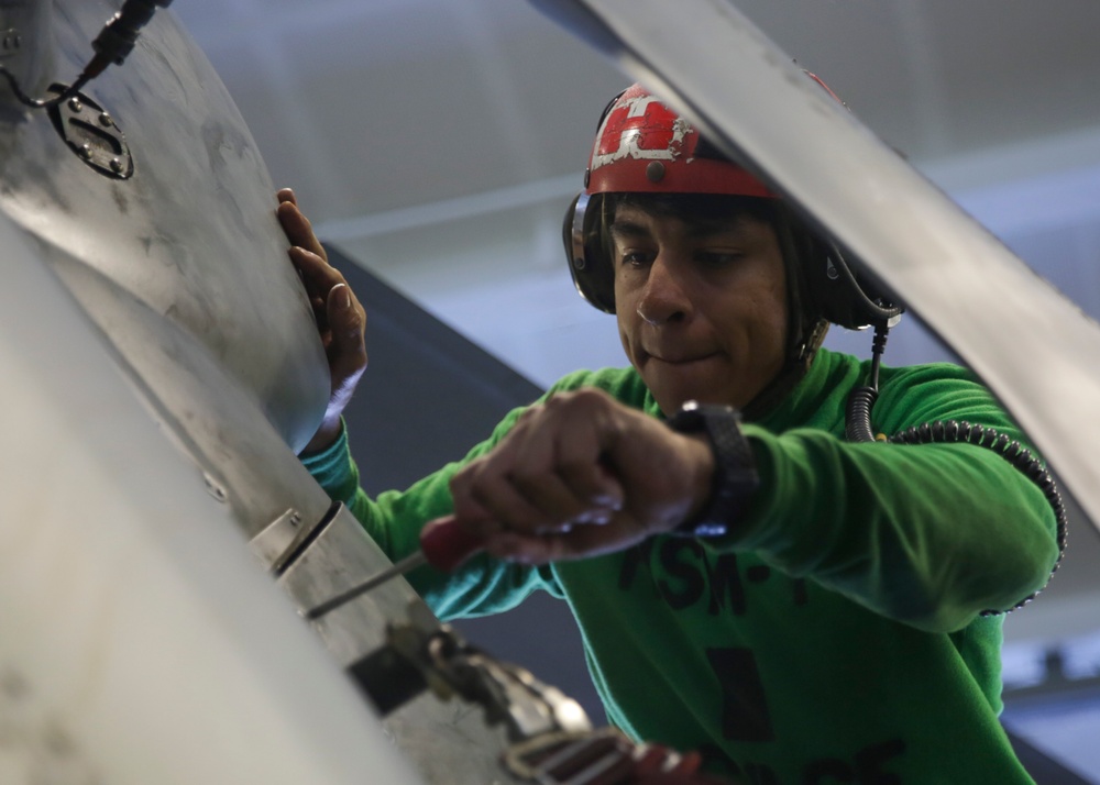 Abraham Lincoln Sailors conduct aircraft maintenance