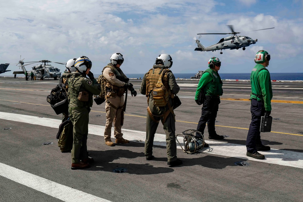 Abraham Lincoln's commanding officer pilots an MH-60R Sea Hawk