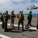 Abraham Lincoln's commanding officer pilots an MH-60R Sea Hawk