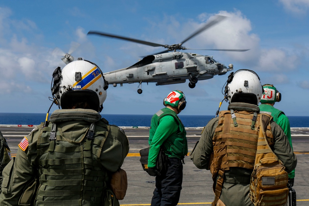 Abraham Lincoln's commanding officer pilots an MH-60R Sea Hawk